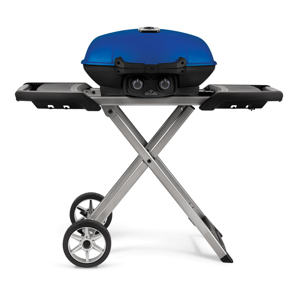Portable propane grill with blue lid and black control panel on scissor cart