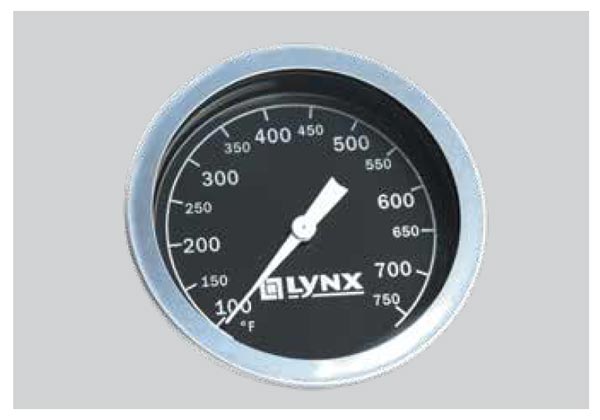 Round grill thermometer gauge showing 150–750°F range with LYNX logo