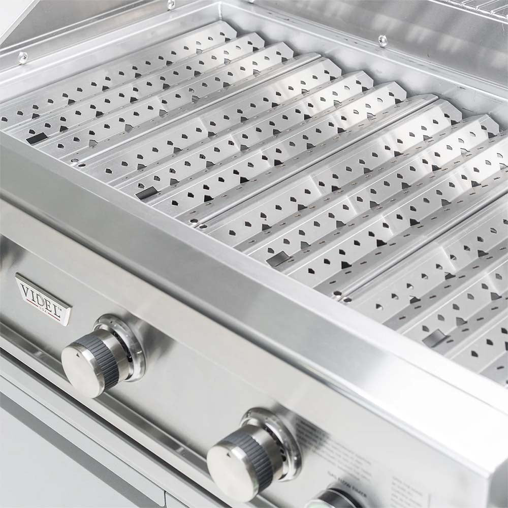 Commercial gas grill burner area with removable cooking grates and control knobs
