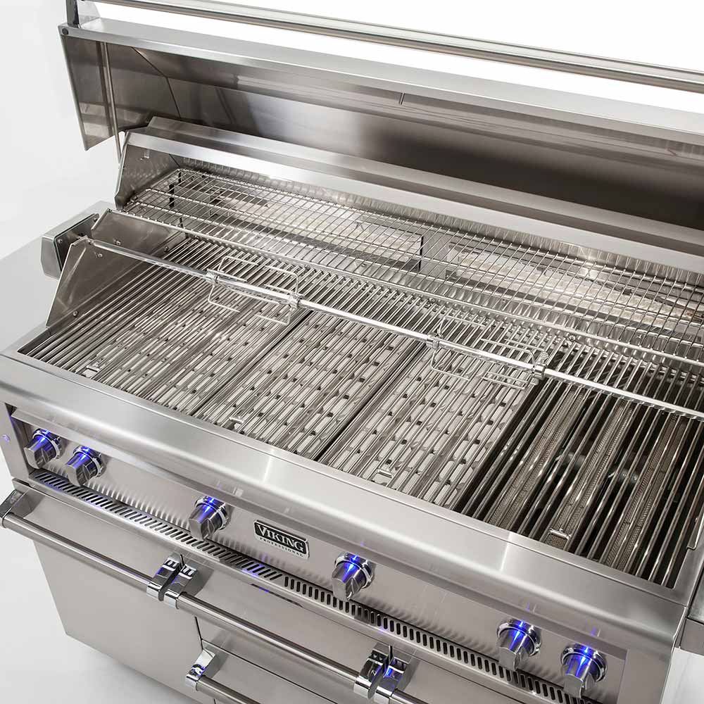 Stainless steel gas grill with open lid, metal grates, and burner row below