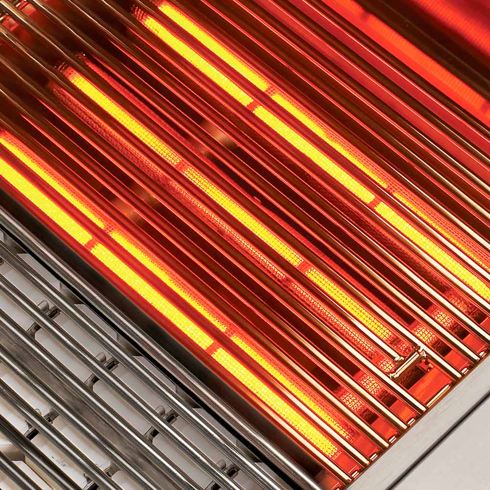 Infrared-style grill burner glowing through stainless burner channels