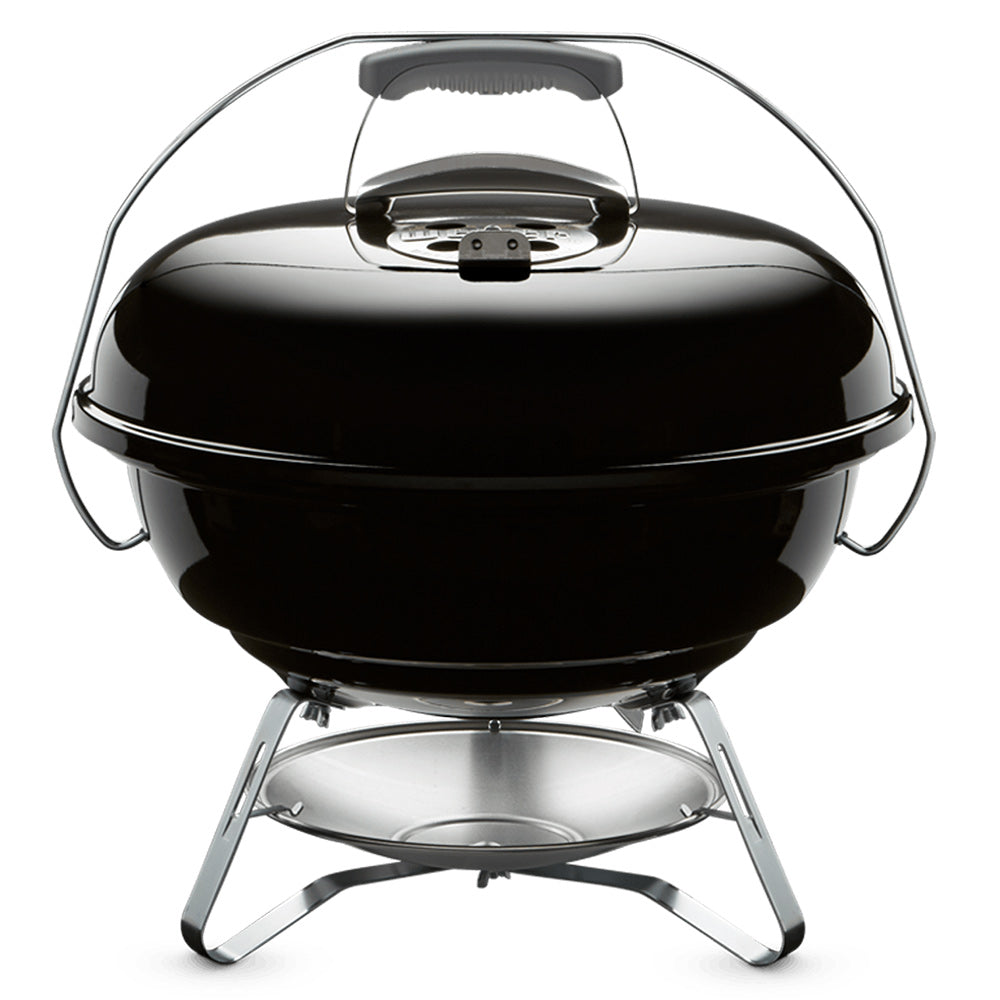 Black 18-inch charcoal grill with domed lid, side handles, and chrome stand legs