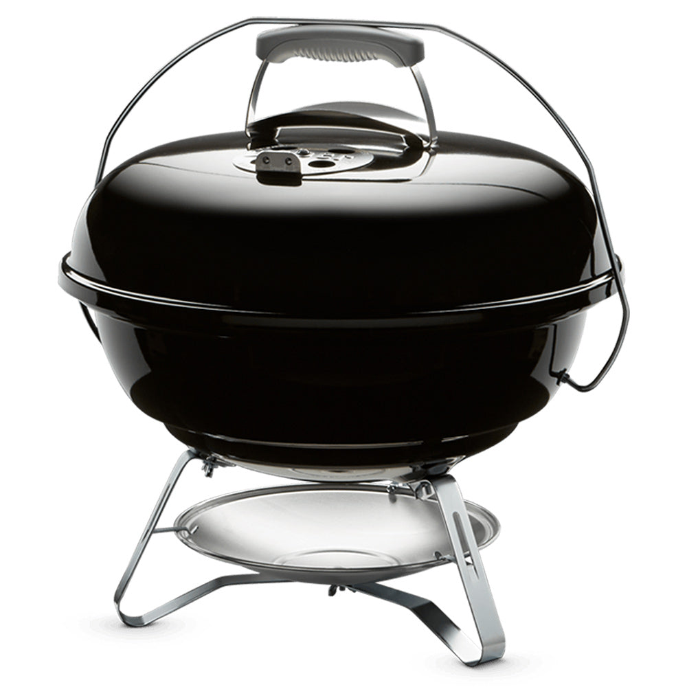 Black 18-inch charcoal grill with domed lid, side handle, and chrome tripod stand
