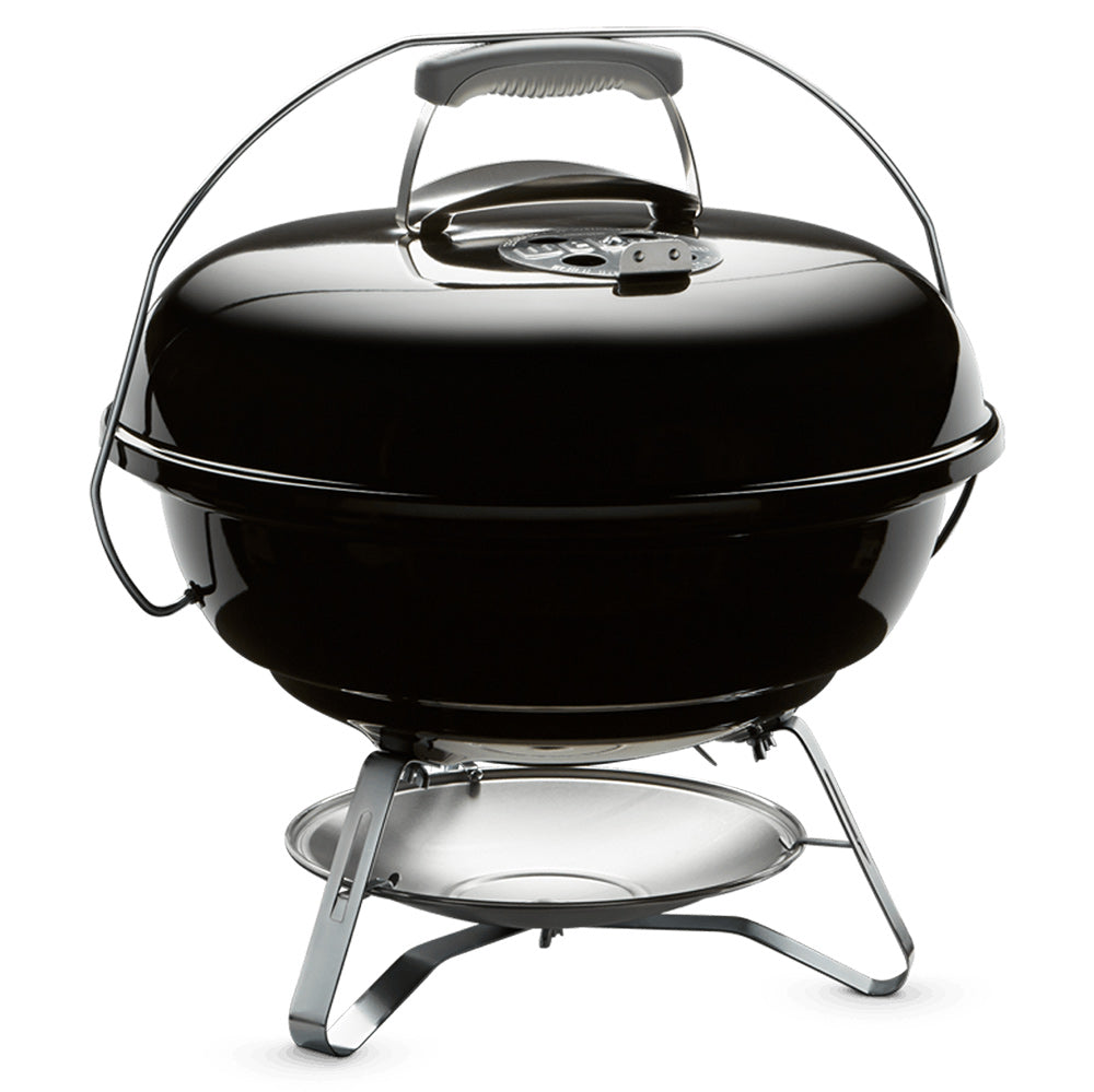 Black 18-inch charcoal grill with open domed lid and metal cooking grate support