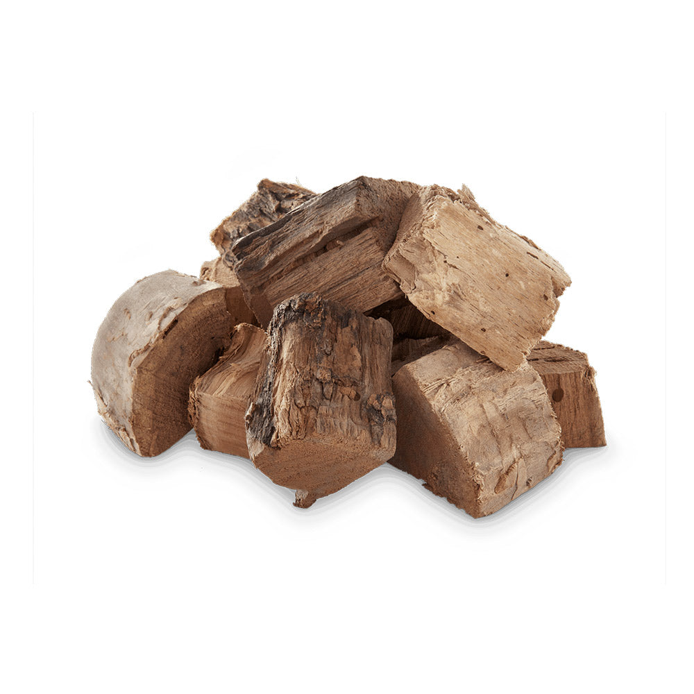 Mesquite wood chunks pile, irregular light-brown logs and wood pieces