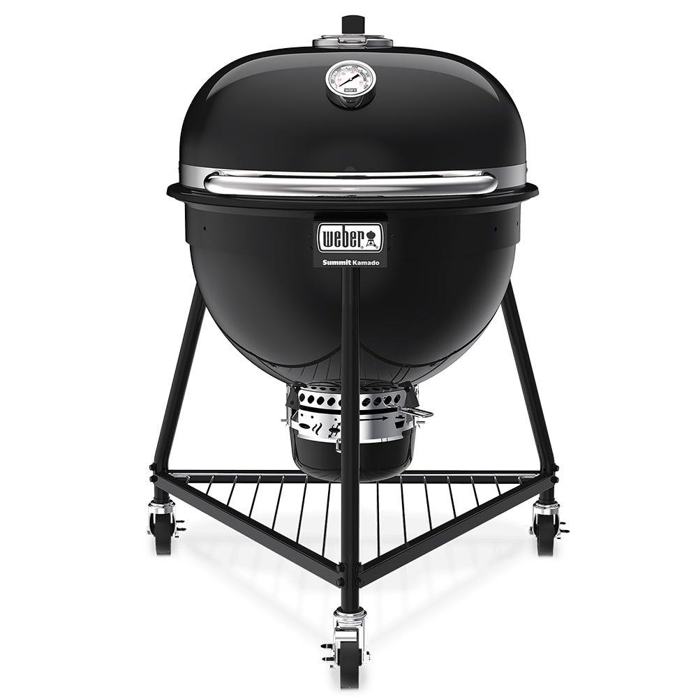 Black kamado-style charcoal grill with domed lid, front control band, and wheeled stand.