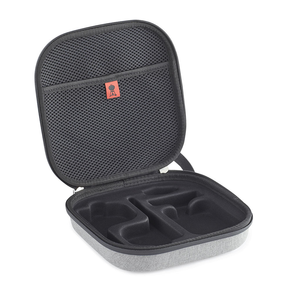Open black interior travel case with gray base and mesh lid, molded compartments