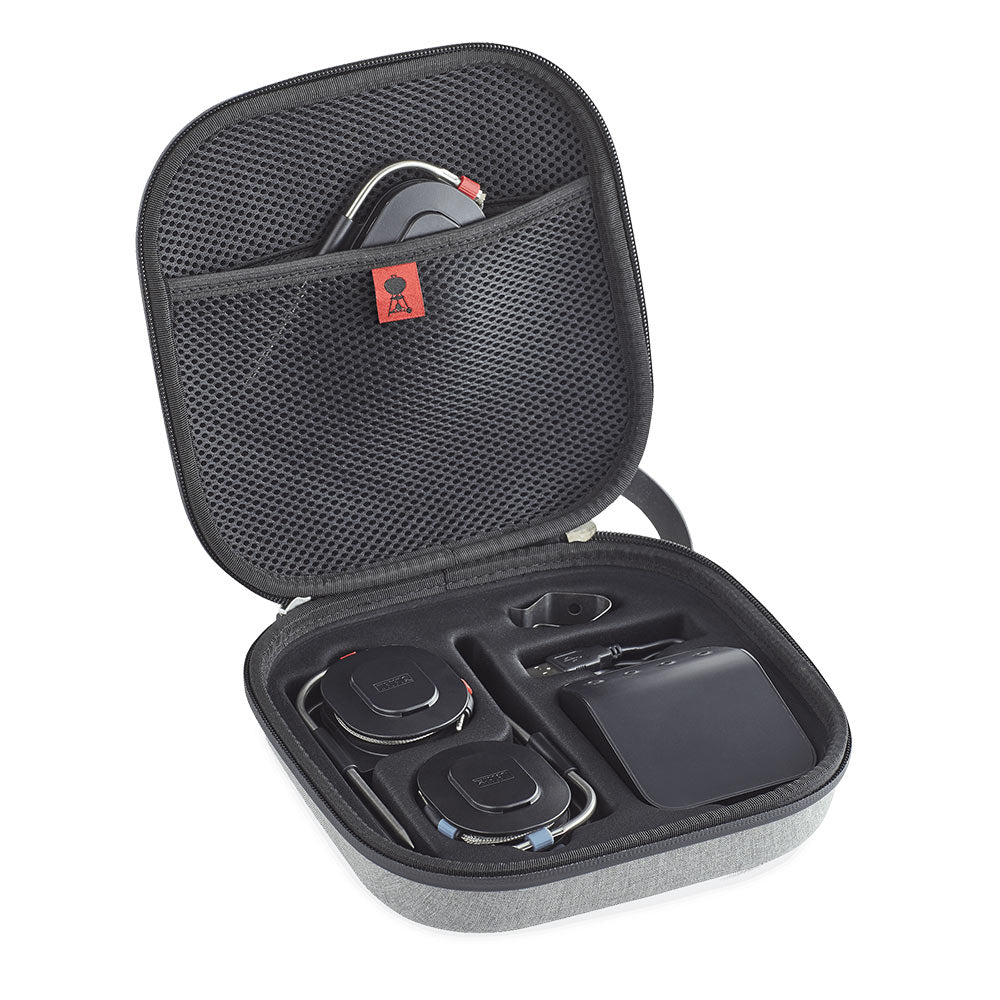 Open travel case showing accessories in molded slots under mesh lid