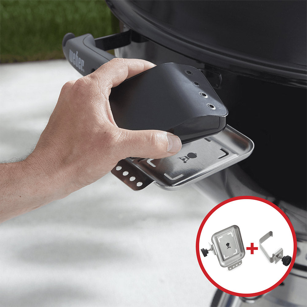 Hand attaching dark mounting plate and metal base to a grill bracket