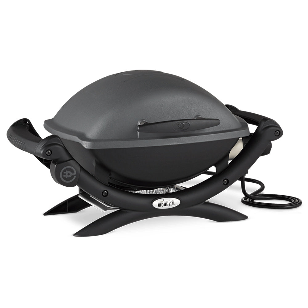 Electric grill with domed lid, side handles, and power cord on right side