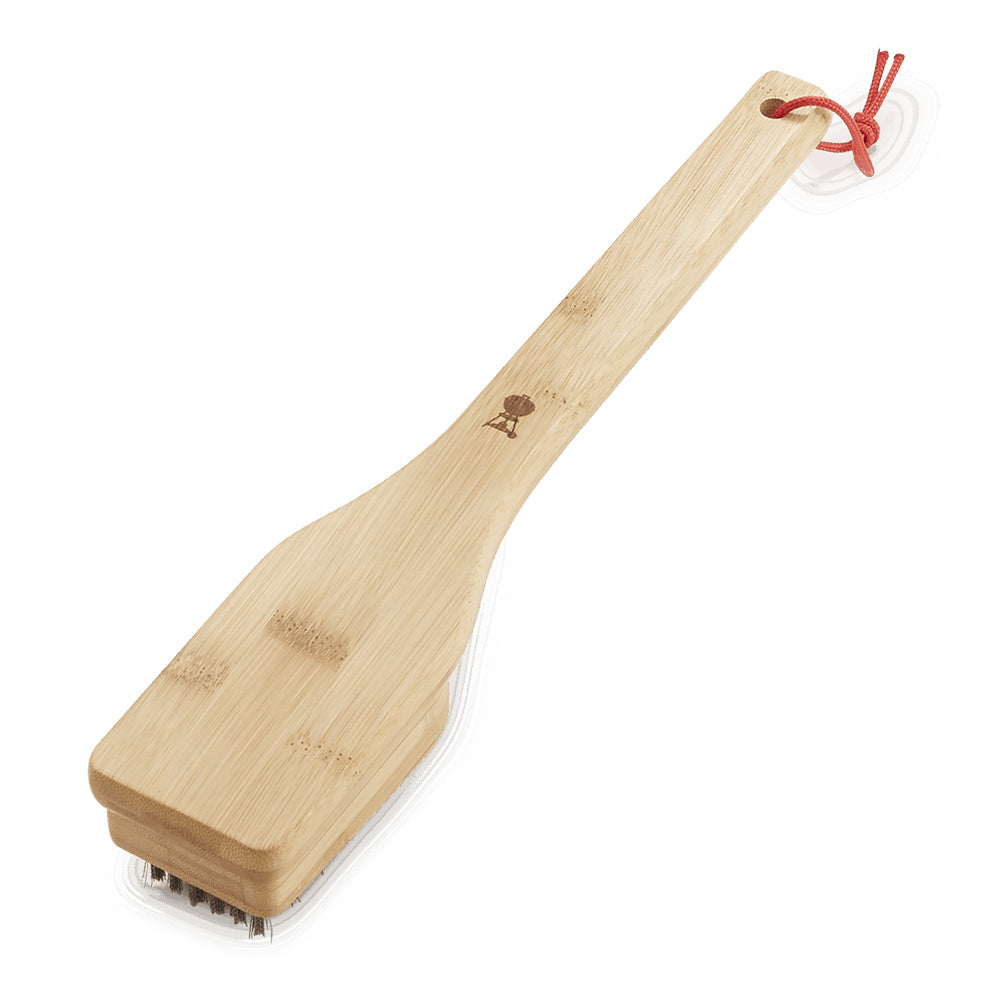 Bamboo grill brush handle with small printed emblem and red hanging loop