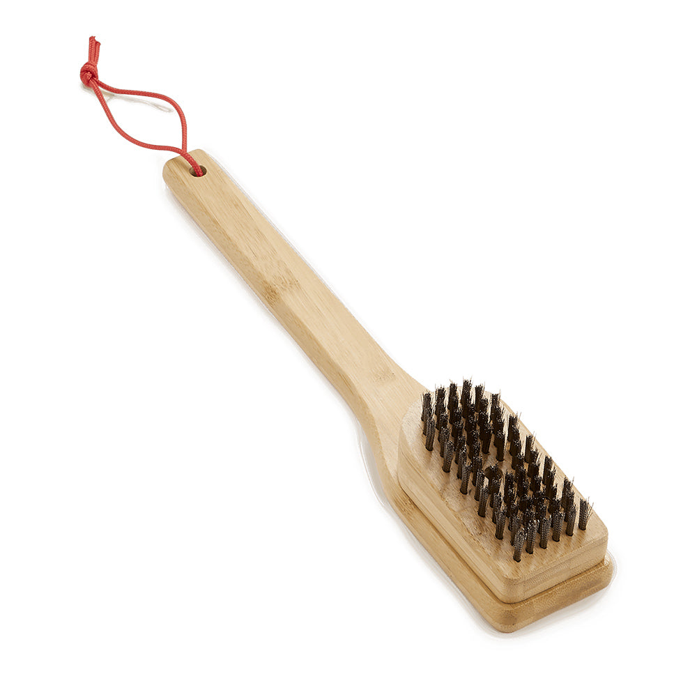 Bamboo grill brush with angled dark bristle scrubbing pad and red loop