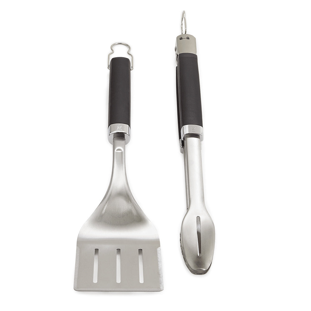 Grill tongs and spatula with black handles and stainless steel heads, pair