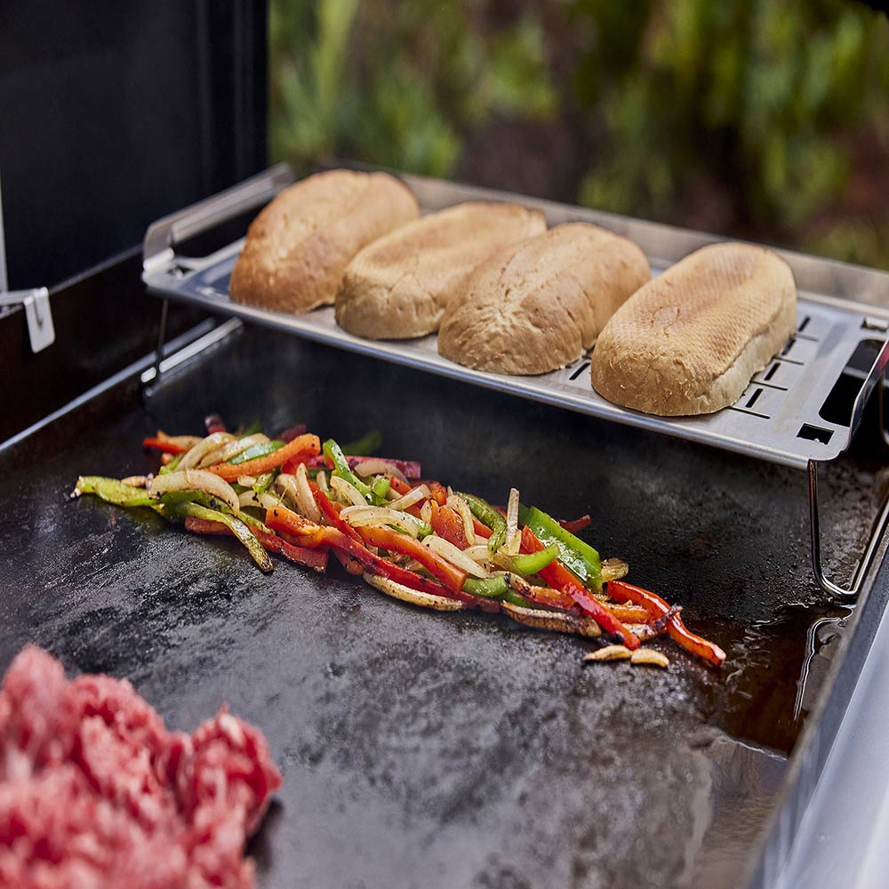 Weber griddle keep warm rack holding bread rolls over grilled food
