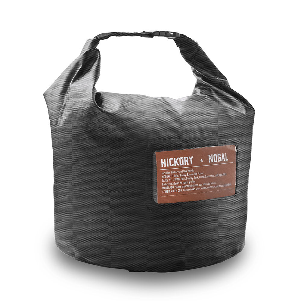 Fuel storage bag with carrying handles and front label pocket, dark fabric.
