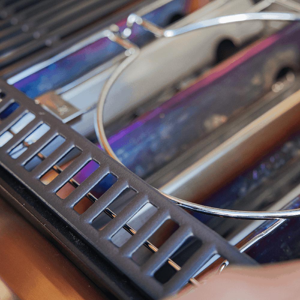 Grill frame kit close-up of dark grate bar with evenly spaced slots and wire