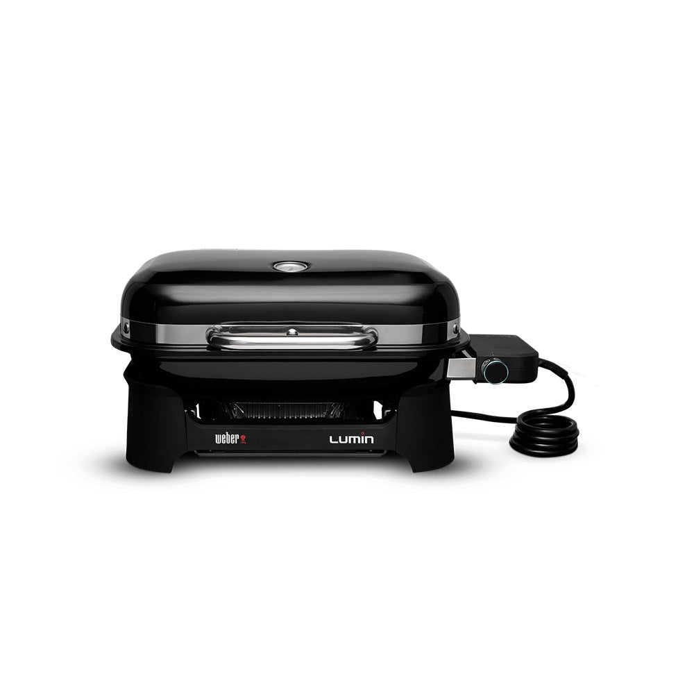 Compact portable electric grill with black lid, front vents, and power cord