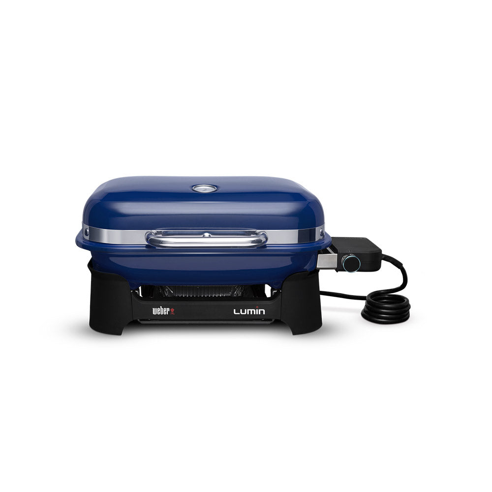 Compact portable electric grill with deep blue lid, front vents, and power cord