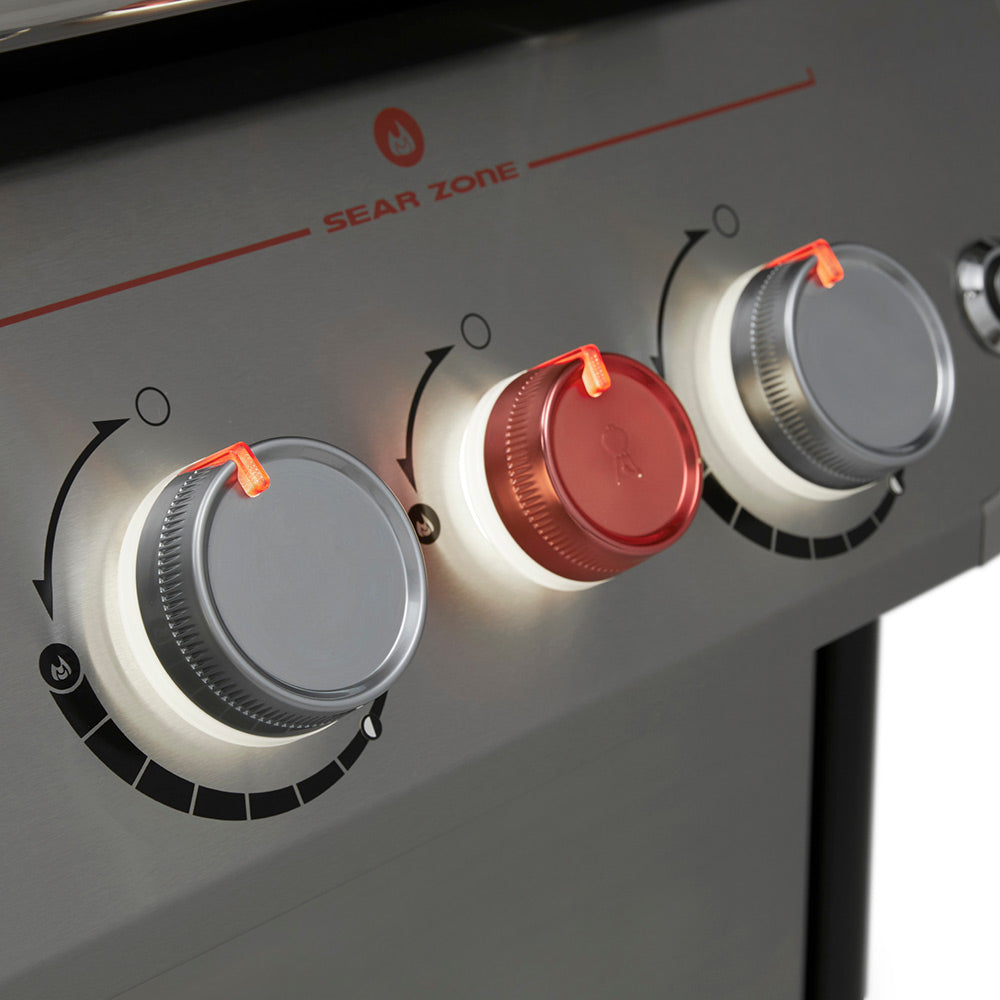 Sear zone burner control knobs with red markers on the gas grill front