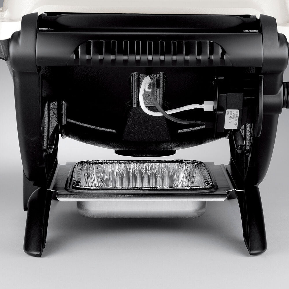 Portable propane grill with open hood showing burner area and grease tray