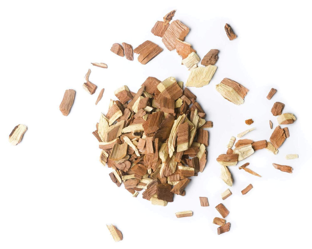Mesquite wood chips pile with small cut wood pieces, light and dark mix