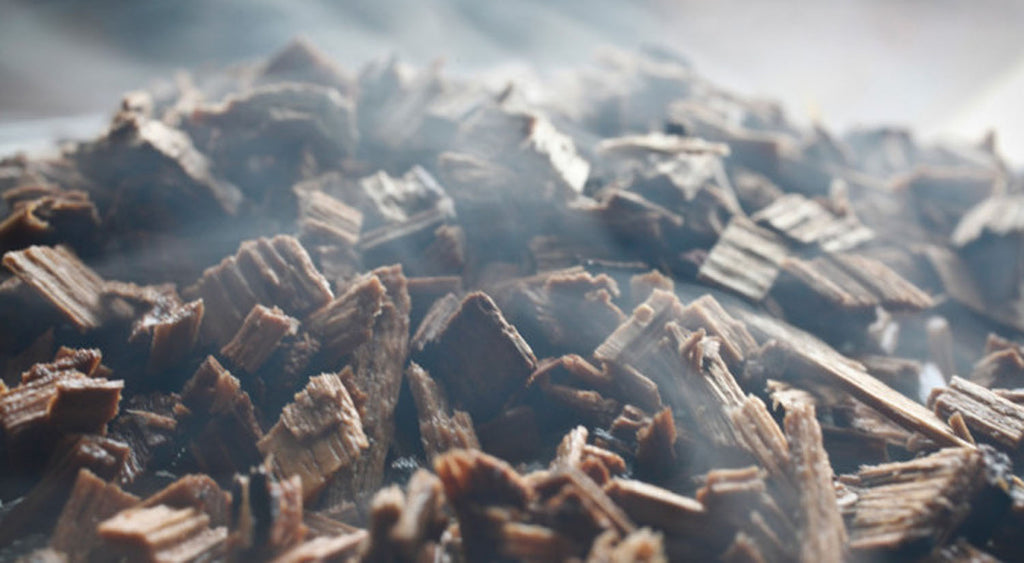 Pile of smoking wood chips, close-up