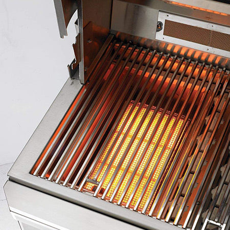 Built-in gas grill with open hood, stainless frame, and glowing burner grates