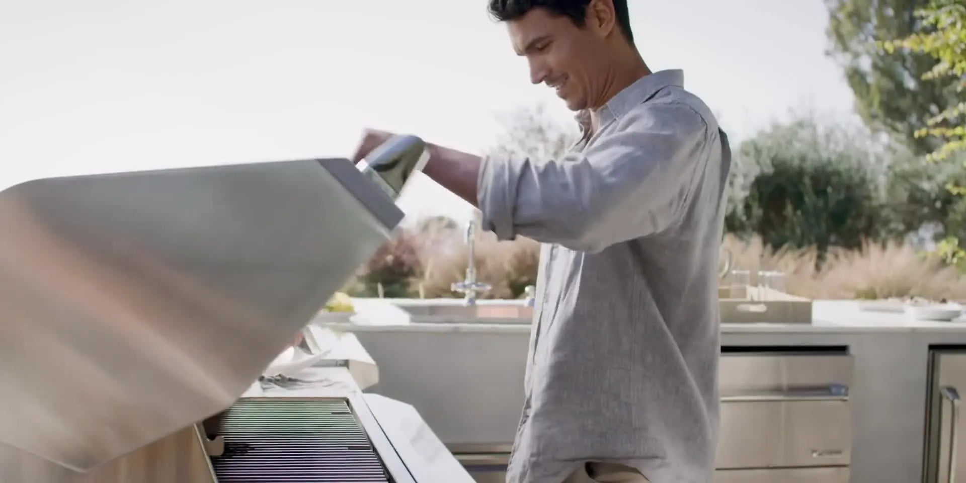 Lifestyle video of people enjoying luxury grill outdoor kitchen