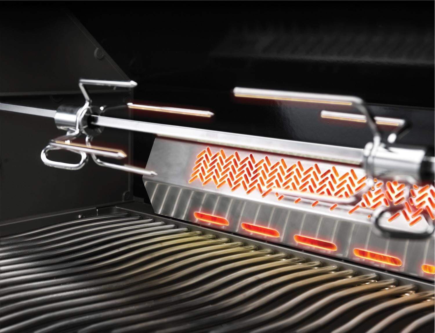 Metal rotisserie forks holding food on a grill spit