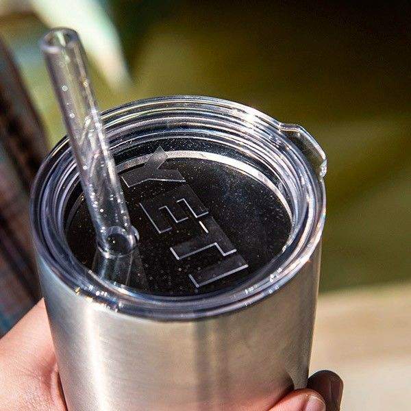 Stainless tumbler with straw lid and clear straw inserted, YETI mark